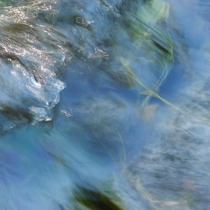 Liquid turquoise and aquamarine – how appropriate a description for the colour of water, though this is far from the ocean.  The colours make me think of glass paperweights; the soft and slightly voluptuous forms and texture are almost jellyfish-like as the water pulses downstream.